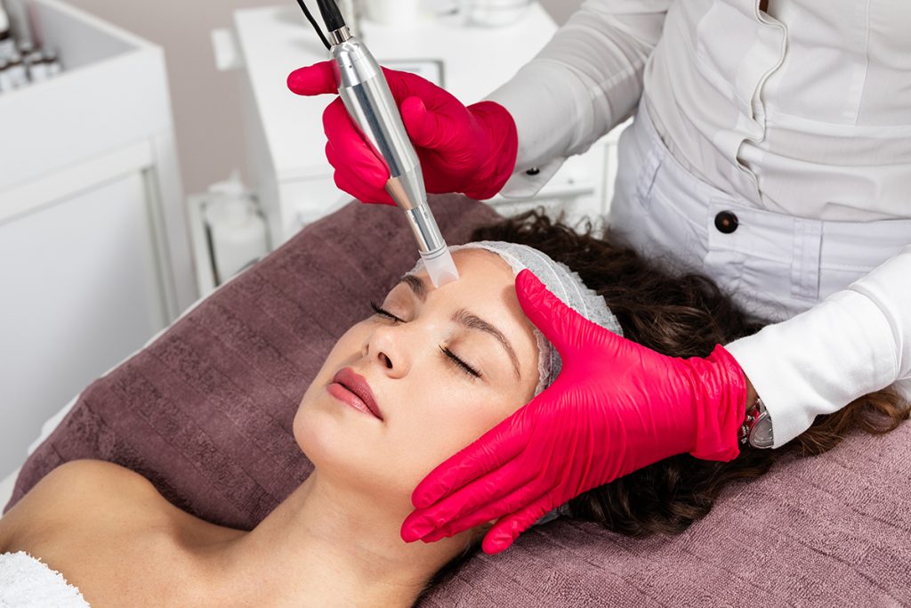 patient receiving microneedling treatment